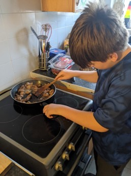 Photo of a boy making Hotpot